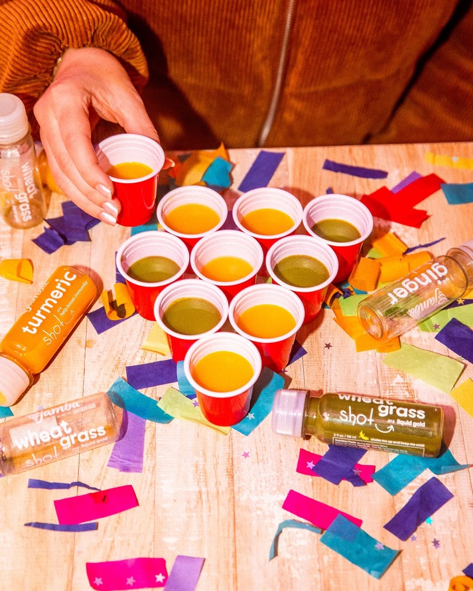 Beer pong played with Jamba turmeric and wheatgrass shots