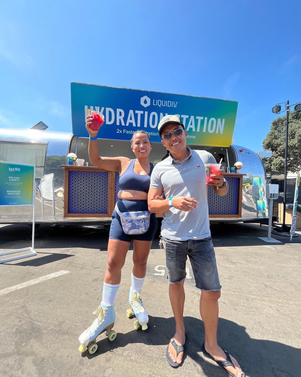 The branded Hydration Station with guests in front of it
