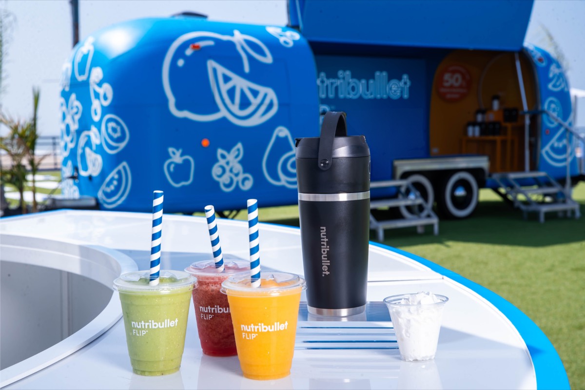 Three smoothies and a NutriBullet blender bottle