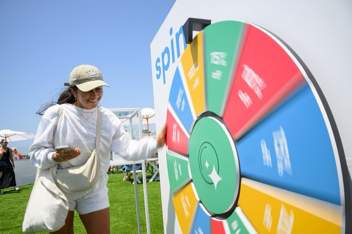 A guest spinning the prize wheel