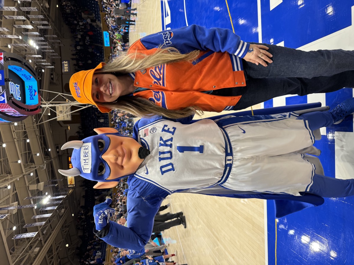 A guest with the Duke Blue Devil mascot