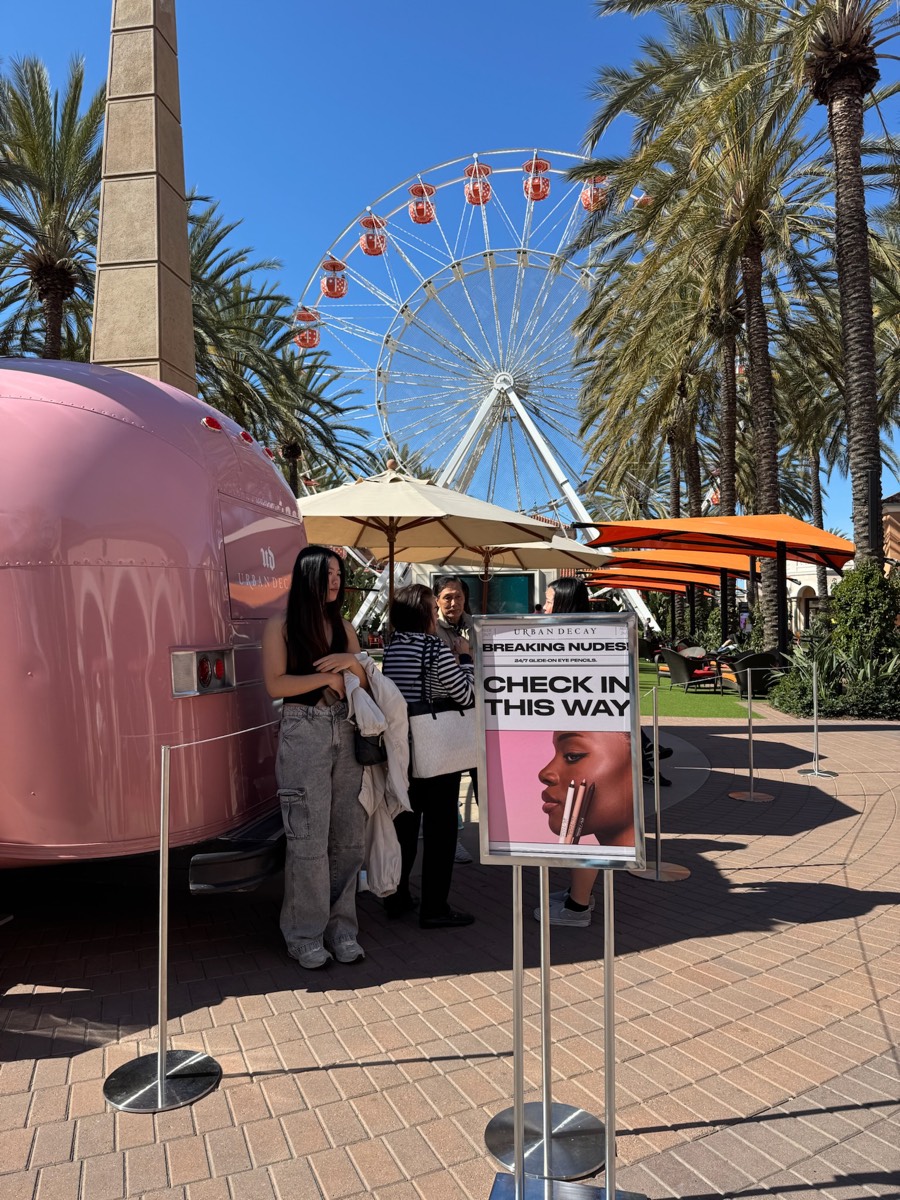 Guests at the Breaking Nudes check-in sign